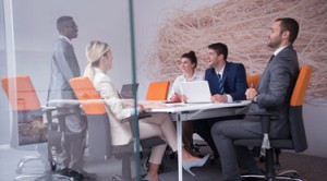 Businesswoman giving an SEO presentation to colleagues at workplace